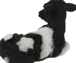 Veau noir et blanc couché en résine (Petit modèle)